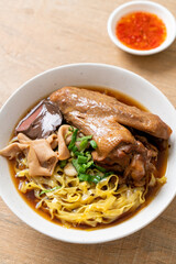 egg noodles with stewed and braised duck in brown soup