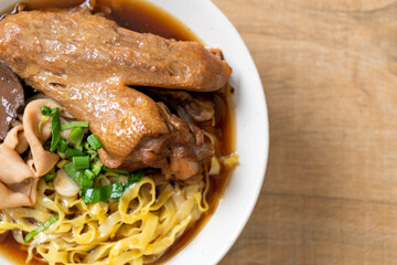 egg noodles with stewed and braised duck in brown soup