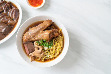 egg noodles with stewed and braised duck in brown soup