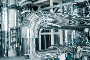 Shiny silver pipeline system and pressure meter at plant