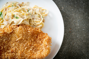spaghetti pasta white cream sauce with fried fish