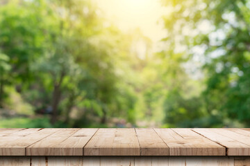 Wooden table and blurred green nature garden background with copy space - 512244127