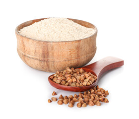 Bowl of flour and spoon with buckwheat grains on white background