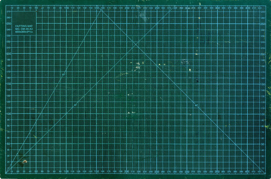 Ultra HD cutting board background used, weathered, cut, old dark green with light green lines with cm measurements and angles checkerboard texture for high resolution wallpaper or mockup