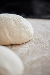 The process of making wheat bread at home. Dough shaping. The concept of healthy homemade food. Vertical photo.