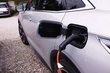 Fototapeta premium electric car charging on the car parking