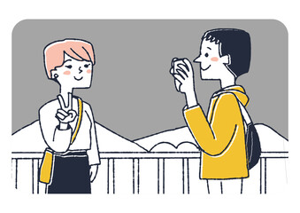 景色をバックに写真を撮るカップルの旅行客　複数人で行く楽しい旅の思い出