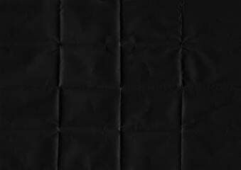 Folded paper texture. Folded black paper texture background. High resolution texture. Folded black paper.