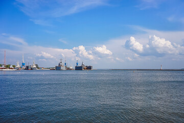 Seascape with war ships under the blue sky.