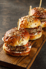 Close-up view of burger on wooden plate