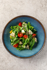 Overhead view of vegetable salad with feta cheese