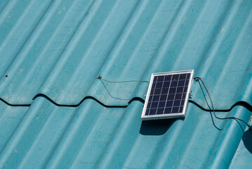 Solar cell, small panel installed on the roof of the house It is an alternative energy. Solar...