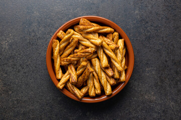 Salted pretzel sticks. Salted crackers in bowl.