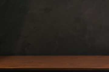 Empty old tabletop in front of blurred blank Blackboard Background in class room. Can be used for display or montage for show your products.