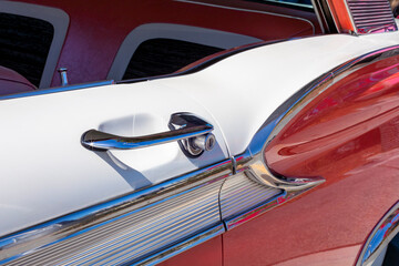 Side door of red vintage car