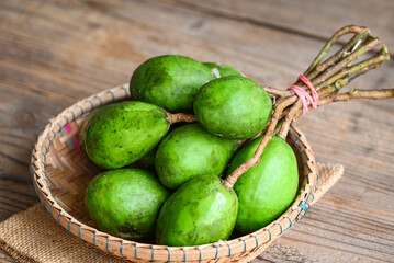 Fruit of Elaeocarpus hygrophilus on wooden background , Spondias mombin