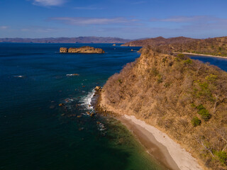 Beautiful aerial view of Costa Rica Beach Playa Rajada in Cuajiniquil Guanacaste in magical yellow sunset
