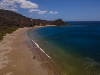 Beautiful aerial view of Costa Rica Beach Playa Rajada in Cuajiniquil Guanacaste in magical yellow sunset