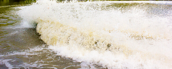 close up of water flowing from a fountain/The background is beautiful, suitable for advertising, free space for advertising.