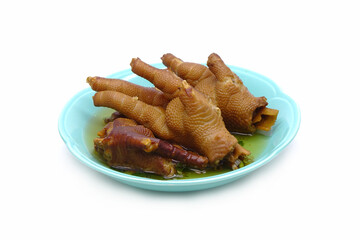 Braised chicken feet on ceramic dishes isolated on white background. Dim Sum, Cantonese food