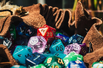 A bunch of rpg dice in a dice bag