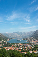Fototapeta na wymiar cruiseschip between the mountains in a bay 