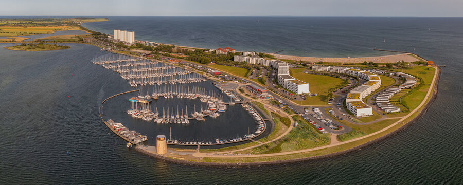 Aerial panoramic view of landscape with boats and sea in marina bay in Burgtiefe-Südstrand, Fehmarn, Germany. Aerial view of landscape with marina and sea resort on the Baltic Sea island of Fehmarn. 