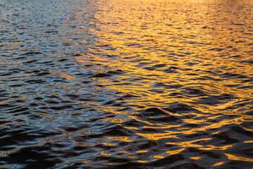 the evening sun water is quiet and beautiful