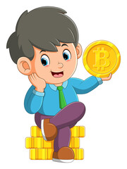 The happy boy is sitting while holding a big bitcoin