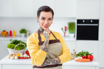 Portrait of attractive cheerful skilled girl preparing meal culinary course spending weekend at...
