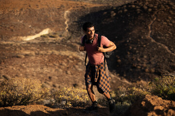 Tourist man hiker on top of the mountain. Active life concept