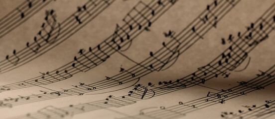 Abstract background with handwritten notes, music notes background, selective focus
