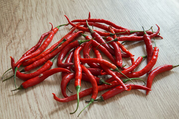 red chili peppers with wooden background