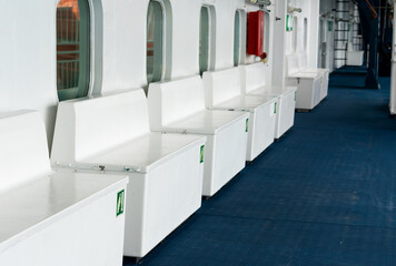 Boxes with Life Jackets inside stored on a large passenger ferry.