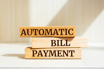 Wooden blocks with words 'AUTOMATIC BILL PAYMENT'. Business concept