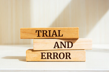 Wooden blocks with words 'trial and error'. Business concept
