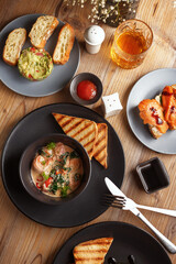 Gourmet meat meals assortment flat lay. Top view on restaurant table with menu of tasty grilled snacks. Concept for restaurant menu.
