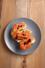 traditional dishes of European cuisine, delicacy, banquet snack. culinary dishes on a gray plate on a wood background. restaurant service. top view