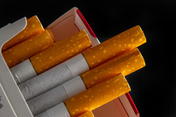 Close up cigarette in pack is addictive to be cancer.smoking reduction campaign in World No Tobacco...