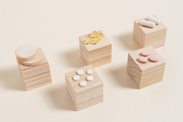 stack of pills arranged on wooden cubes