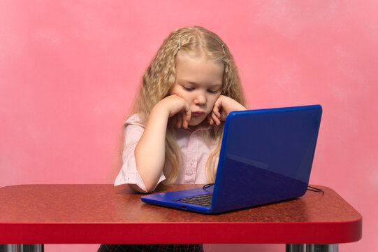 Sad, Brooding Schoolgirl Behind The Lepton. Pink Background.