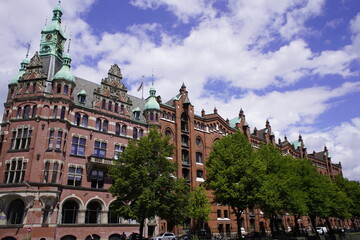 Fototapeta na wymiar The Speicherstadt (lit. city of warehouses, meaning warehouse district) in Hamburg, Germany is the largest timber-pile founded warehouse district in the world.
