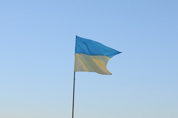yellow and blue flag of Ukraine on stock on sky background