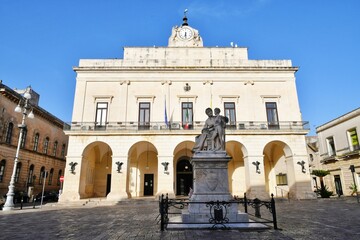 A small square in the historic district of Maglie, a village in the Puglia region of Italy.	