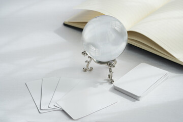 the abstract white fortune-telling or predict with a crystal ball and book clean minimal style mood...