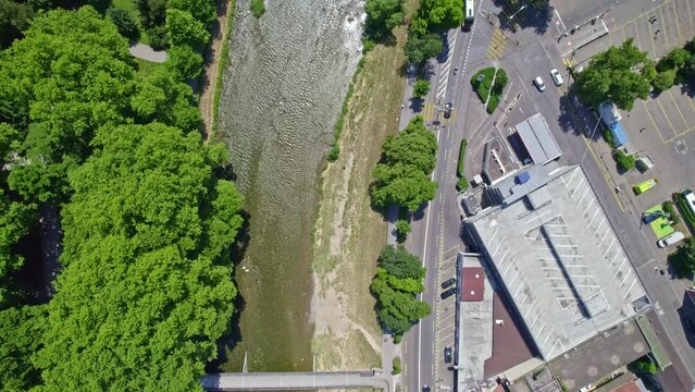 Aerial view of Sihl River and main road with bridge at City of Z&uuml;rich on a sunny summer day. Slow motion movie shot June 20th, 2022, Zurich, Switzerland.