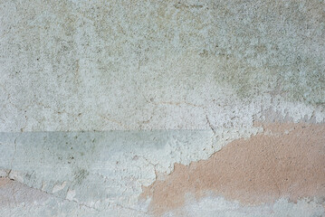 Old cement wall with discolored paint