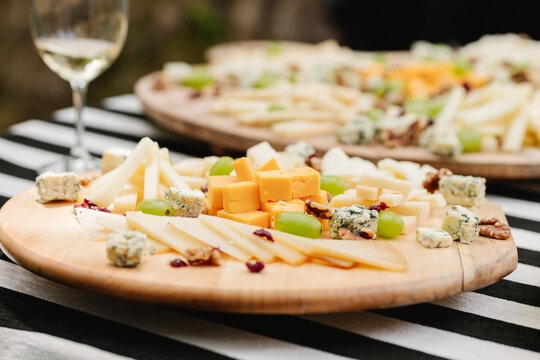 Assorted cheese on wooden board