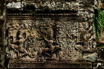 A sandstone wall sculpture of Apsara dancing at Bayon Angkor Thom Temple, Siem Reap, Cambodia
