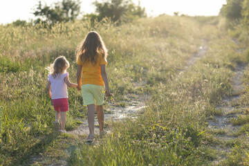 Fototapeta premium Two children are walking in nature